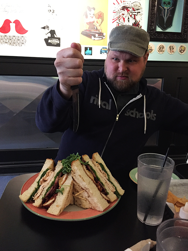 Gabriel and the enormous Turducken Club sandwich. — at Early Bird Cafe.