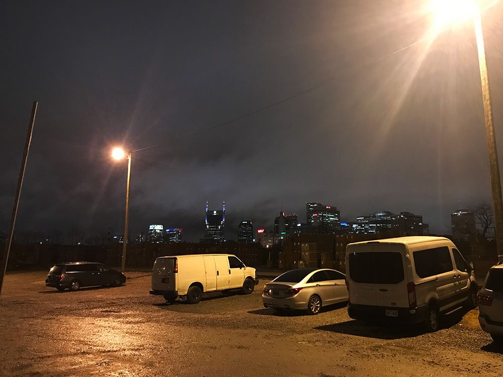 Our van (right) with the Nashville Skyline, behind Little Harpeth Brewing. — in Nashville, Tennessee.