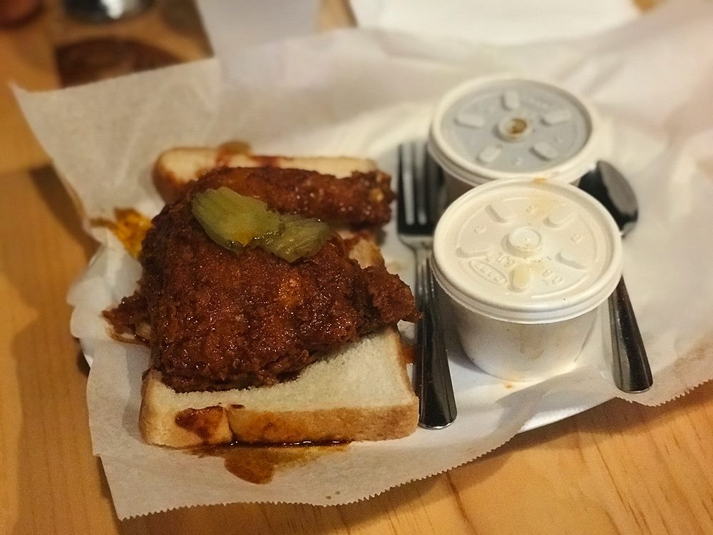 Half-Leg all darkmeat with sides of baked beans and cole-slaw. — at Prince`s Hot Chicken South.
