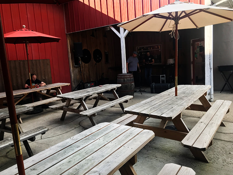 Looking towards the stage on the patio at Jackie O`s Brewery — with Gabriel Doman and Bob Moulton.